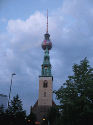 St. Mary`s Church and the Fernsehturm tower, viewed from the Karl-Liebknecht Straße street, at sunset