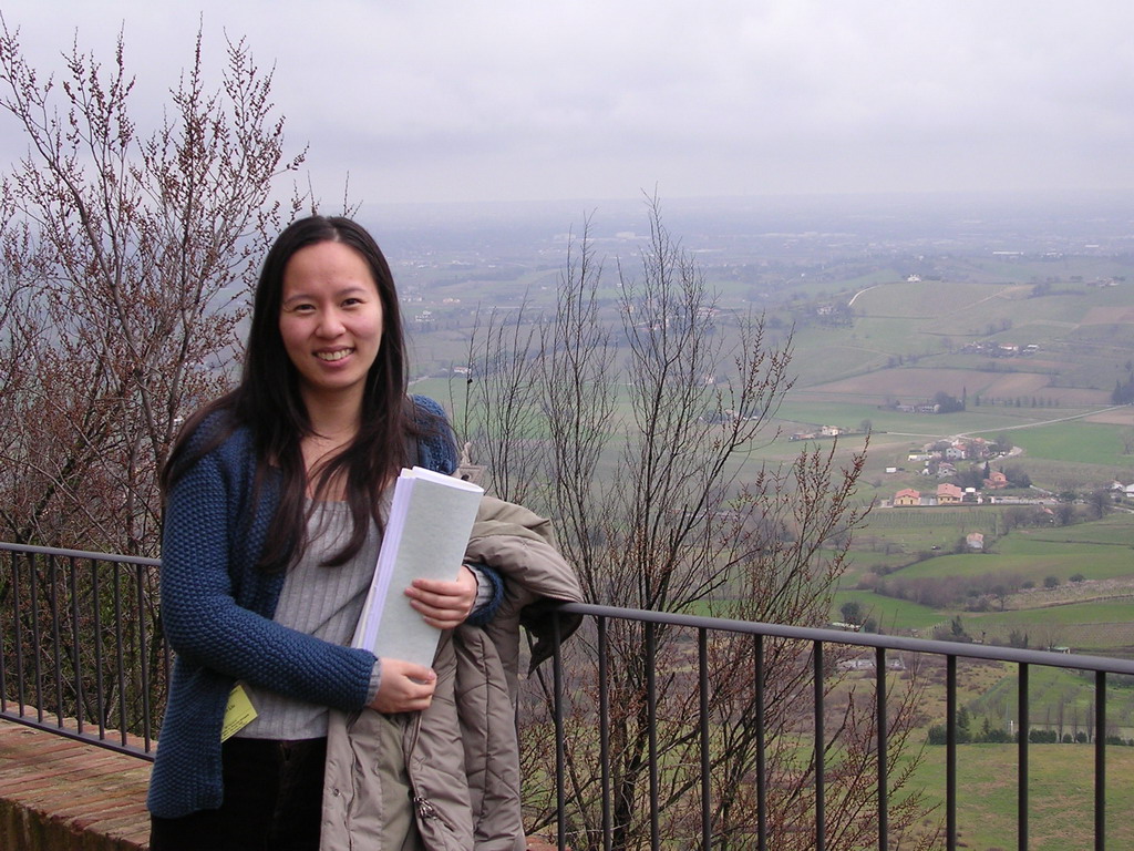 Miaomiao`s friend at the parking lot of the La Rocca castle, with a view on the hills at the west side of the town