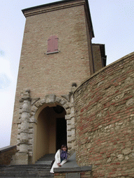 Miaomiao in front of the main gate of the La Rocca castle