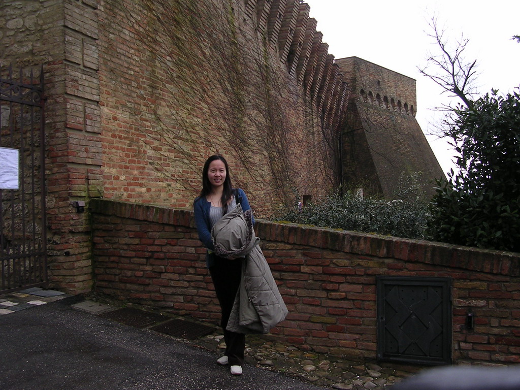 Miaomiao`s friend in front of the gate at the outer square of the La Rocca castle