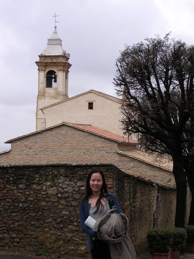 Miaomiao`s friend in front of a church in the town center