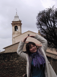 Miaomiao in front of a church in the town center