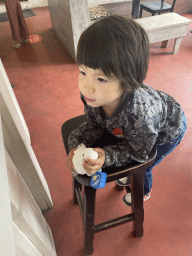 Max with a Snowy Owl toy at the restaurant at BestZoo