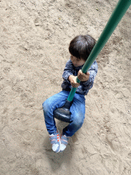 Max on a zip line at the playground at BestZoo