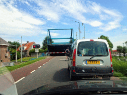 The Biesboschsluis sluice over the Steurgat river, viewed from the car on the Bandijk street of Werkendam