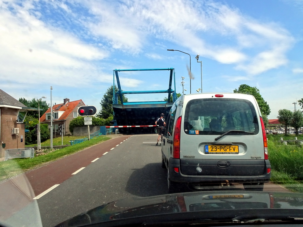 The Biesboschsluis sluice over the Steurgat river, viewed from the car on the Bandijk street of Werkendam