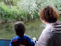 Miaomiao and Max looking at fish in the Sloot Beneden Petrus creek, viewed from the Fluistertocht tour boat