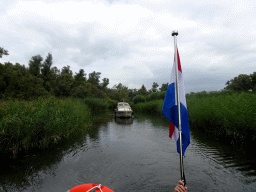 Boat on the Sloot Beneden Petrus creek, viewed from the Fluistertocht tour boat