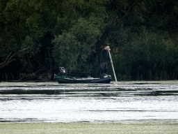 Boat on the Gat van de Buisjes lake, viewed from the Fluistertocht tour boat