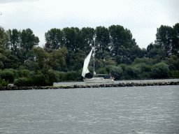 Sailboat on the Gat van van Kampen lake, viewed from the Fluistertocht tour boat