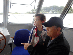 Max and Miaomiao`s father at the Fluistertocht tour boat