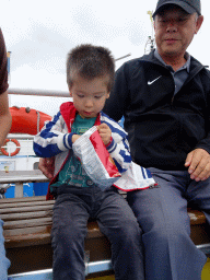 Max and Miaomiao`s father on the Biesbosch Ferry over the Nieuwe Merwede canal