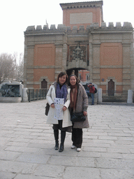 Miaomiao and her friend in front of the Porta Galliera gate at the Piazza XX Settembre square