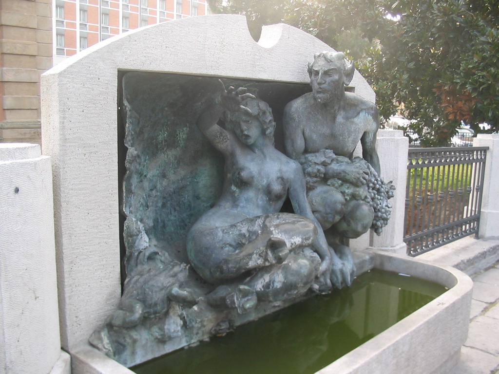 Fountain at the right front of the Porta Galliera gate at the Piazza XX Settembre square