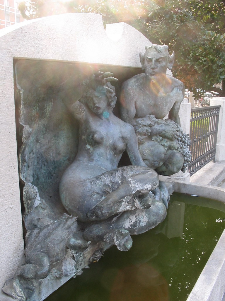 Fountain at the right front of the Porta Galliera gate at the Piazza XX Settembre square