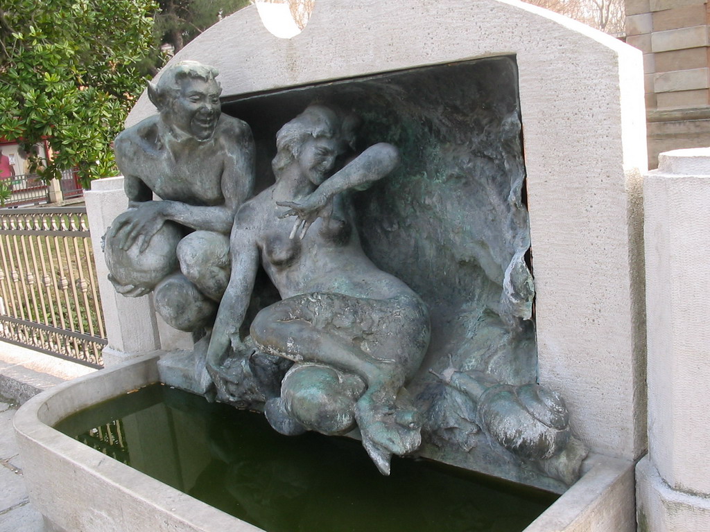 Fountain at the left front of the Porta Galliera gate at the Piazza XX Settembre square