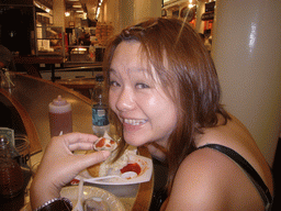 Miaomiao eating clams, inside Quincy Market at Faneuil Hall Marketplace
