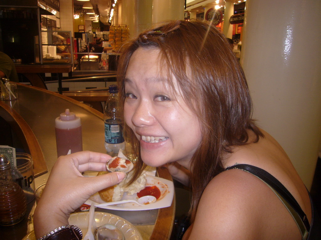 Miaomiao eating clams, inside Quincy Market at Faneuil Hall Marketplace