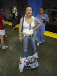 Miaomiao with laundry in the subway station
