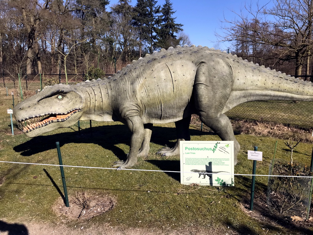 Statue of a Postosuchus in the Garden of the Oertijdmuseum, with explanation