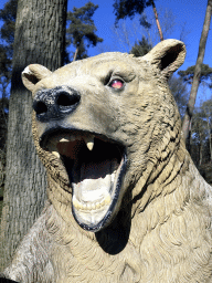 Head of the statue of a Cave Bear in the Oertijdwoud forest of the Oertijdmuseum