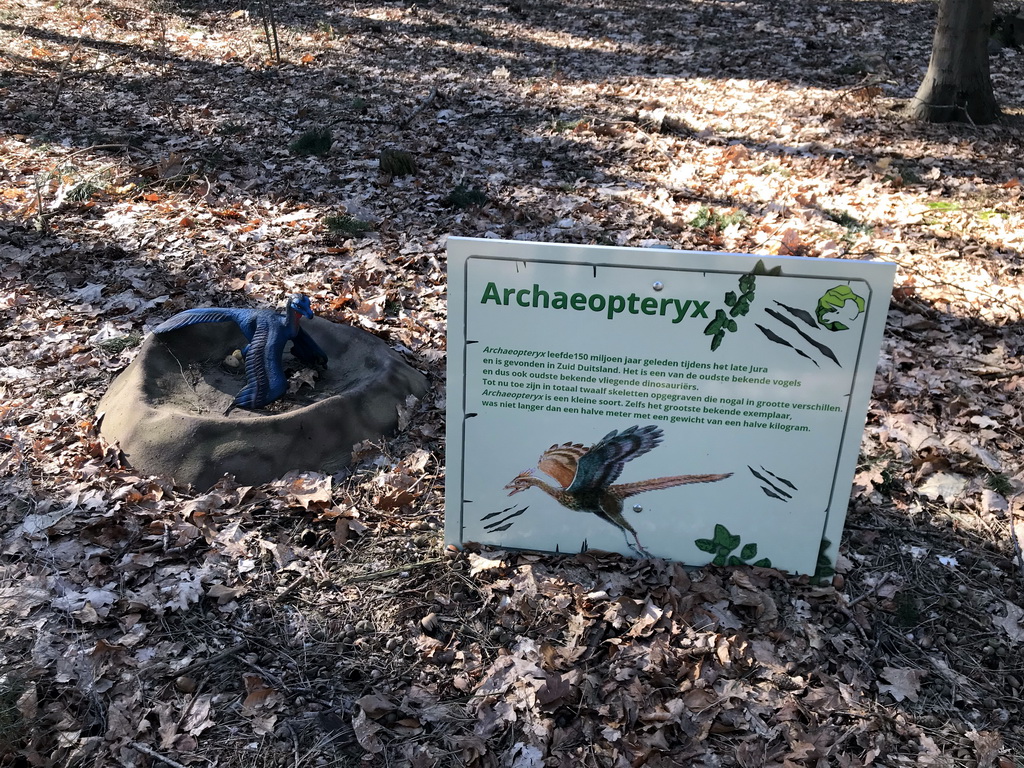 Statue of an Archaeopteryx in the Oertijdwoud forest of the Oertijdmuseum, with explanation
