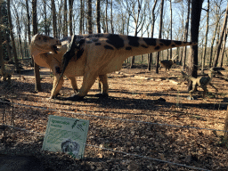 Statue of an Iguanodon in the Oertijdwoud forest of the Oertijdmuseum, with explanation
