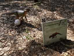 Statue of a Psittacosaurus in the Oertijdwoud forest of the Oertijdmuseum, with explanation