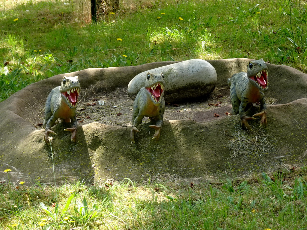 Statues of young Tyrannosaurus Rex in the Oertijdwoud forest of the Oertijdmuseum