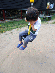 Max at the playground in the Garden of the Oertijdmuseum