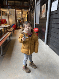 Max with a shark toy at the hallway from the Dinohal building to the Museum building of the Oertijdmuseum