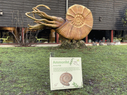 Ammonite statue in front of the Museum building in the Garden of the Oertijdmuseum, with explanation