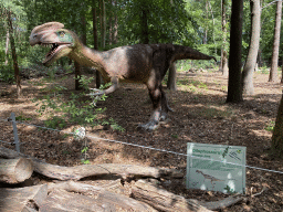 Dilophosaurus statue in the Oertijdwoud forest of the Oertijdmuseum, with explanation