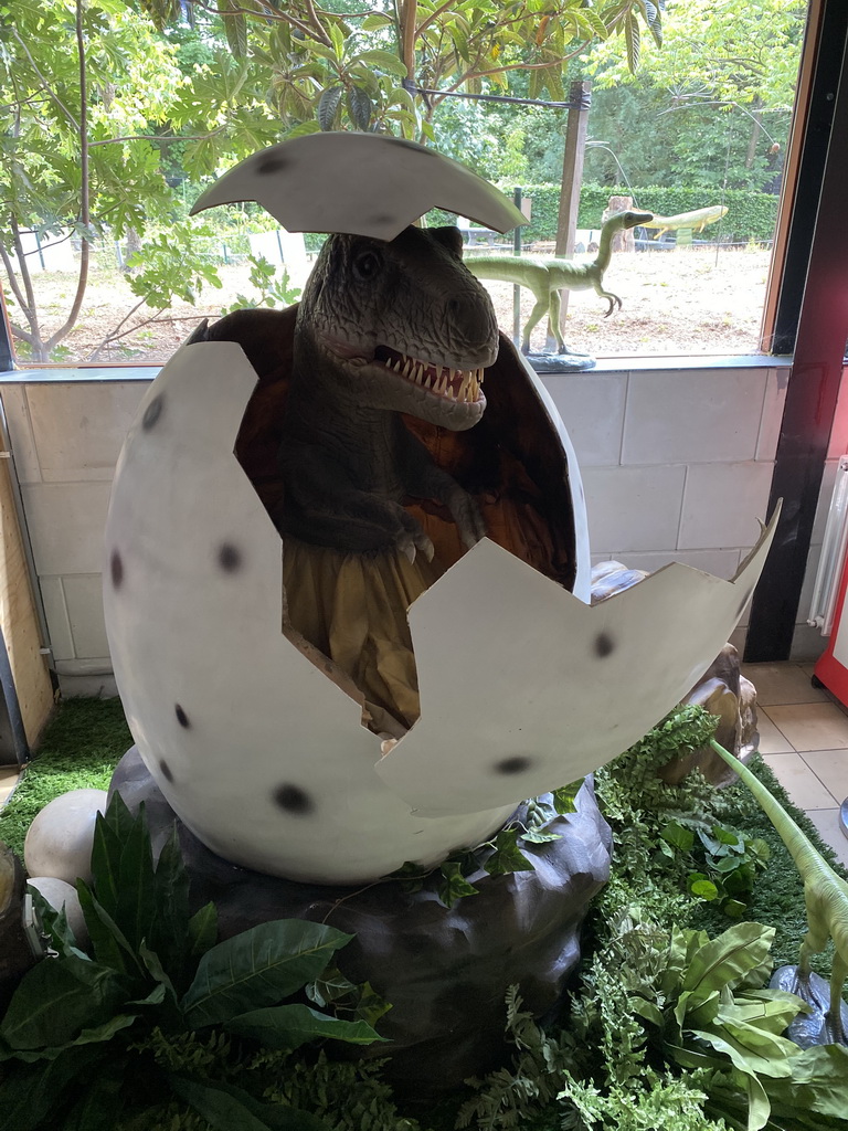 Statue of a Tyrannosaurus Rex coming out of an egg at the Lower Floor of the Museum Building of the Oertijdmuseum