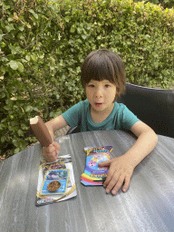 Max with an ice cream and toys at the terrace of the restaurant at the Lower Floor of the Museum building of the Oertijdmuseum