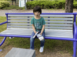 Max with toys on a bench in the Garden of the Oertijdmuseum