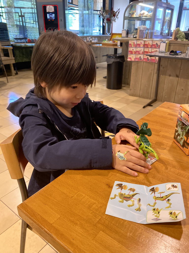 Max playing with his Dilophosaurus toy at the restaurant at the Lower Floor of the Dinohal building of the Oertijdmuseum