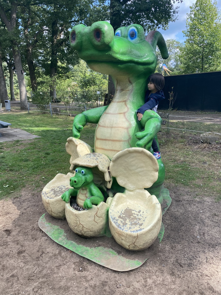 Max on a statue of a Crocodile with eggs at the playground in the Oertijdwoud forest of the Oertijdmuseum