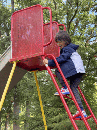 Max on a slide at the playground in the Oertijdwoud forest of the Oertijdmuseum