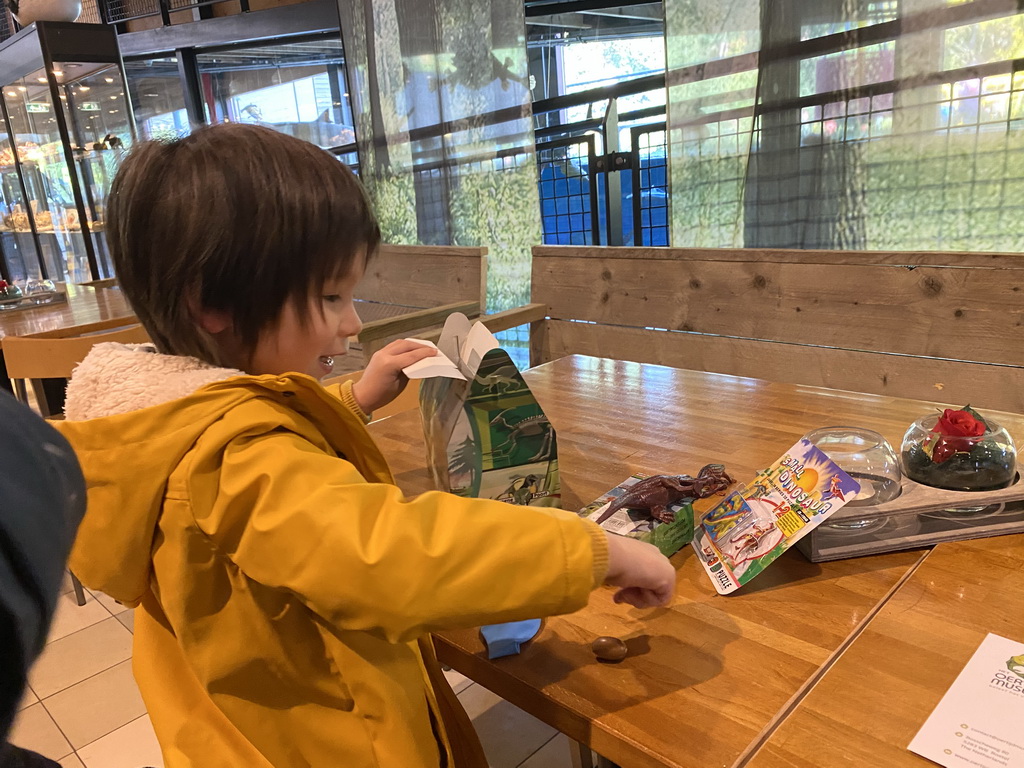 Max playing with toys from the surprise box at the restaurant at the Lower Floor of the Museum building of the Oertijdmuseum