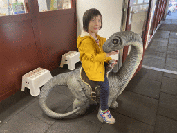 Max on a Diplodocus statue at the Upper Floor of the Museum building of the Oertijdmuseum