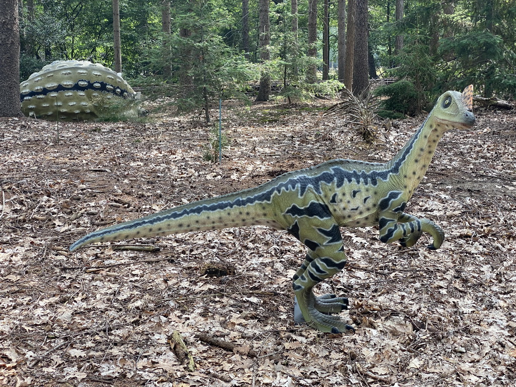 Statue of a Dilong Paradoxus in the Oertijdwoud forest of the Oertijdmuseum