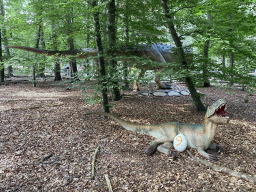 Statues of Allosauruses and a Stegosaurus in the Oertijdwoud forest of the Oertijdmuseum