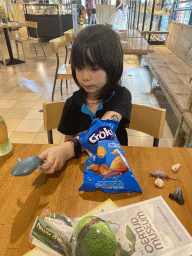 Max with chips and toys at the restaurant at the Lower Floor of the Museum building of the Oertijdmuseum