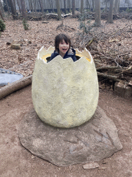 Max in an egg statue in the Oertijdwoud forest of the Oertijdmuseum