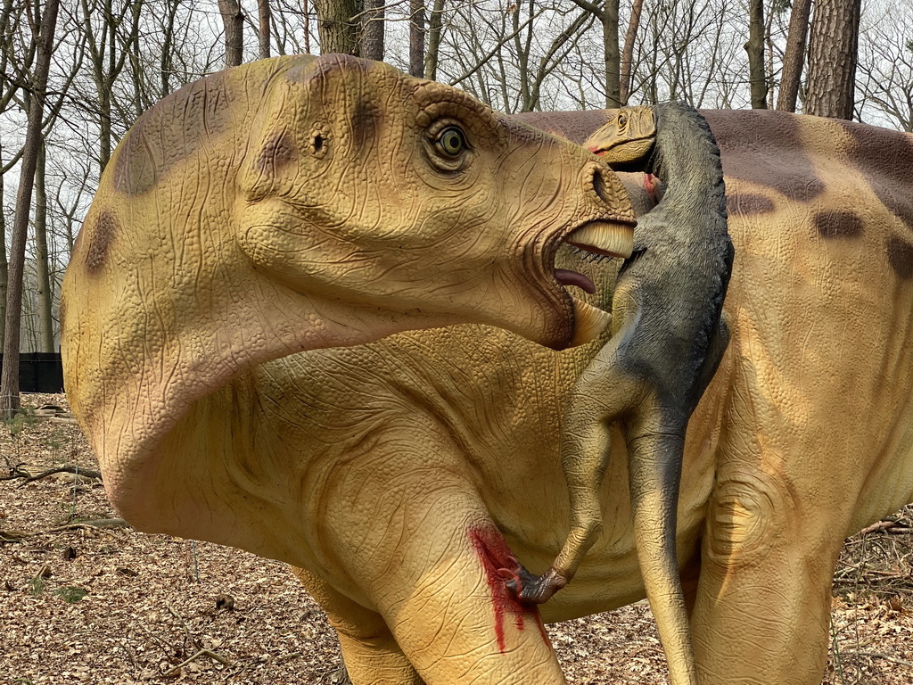 Statue of an Iguanodon being attacked by a Deinonychus in the Oertijdwoud forest of the Oertijdmuseum