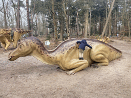 Max climbing on a Maiasaura statue in the Oertijdwoud forest of the Oertijdmuseum