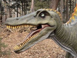 Head of a statue of a Spinosaurus in the Oertijdwoud forest of the Oertijdmuseum