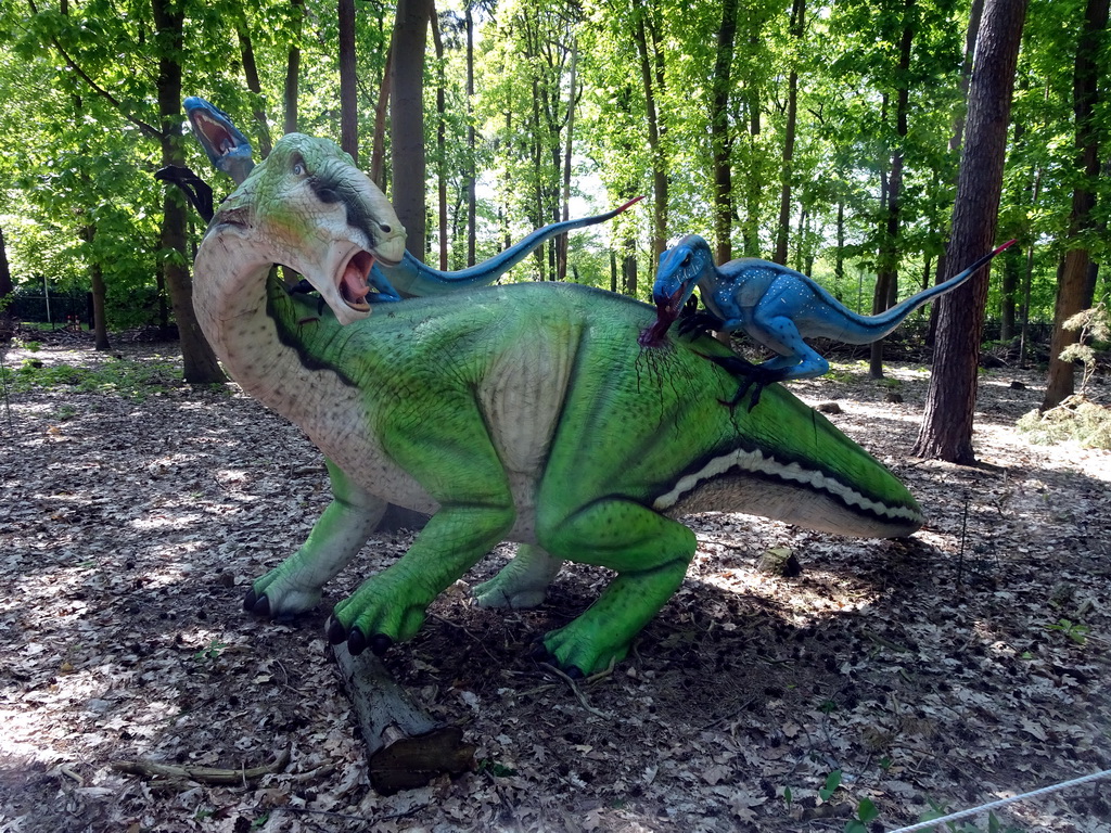 Statue of a Tenontosaurus being attacked by Deinonychuses in the Oertijdwoud forest of the Oertijdmuseum