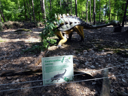 Statue of an Euoplocephalus in the Oertijdwoud forest of the Oertijdmuseum, with explanation